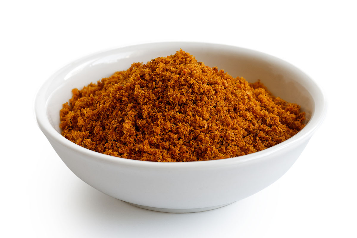 Mace powder in a white bowl.