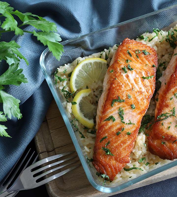 two baked fish fillets over rice.