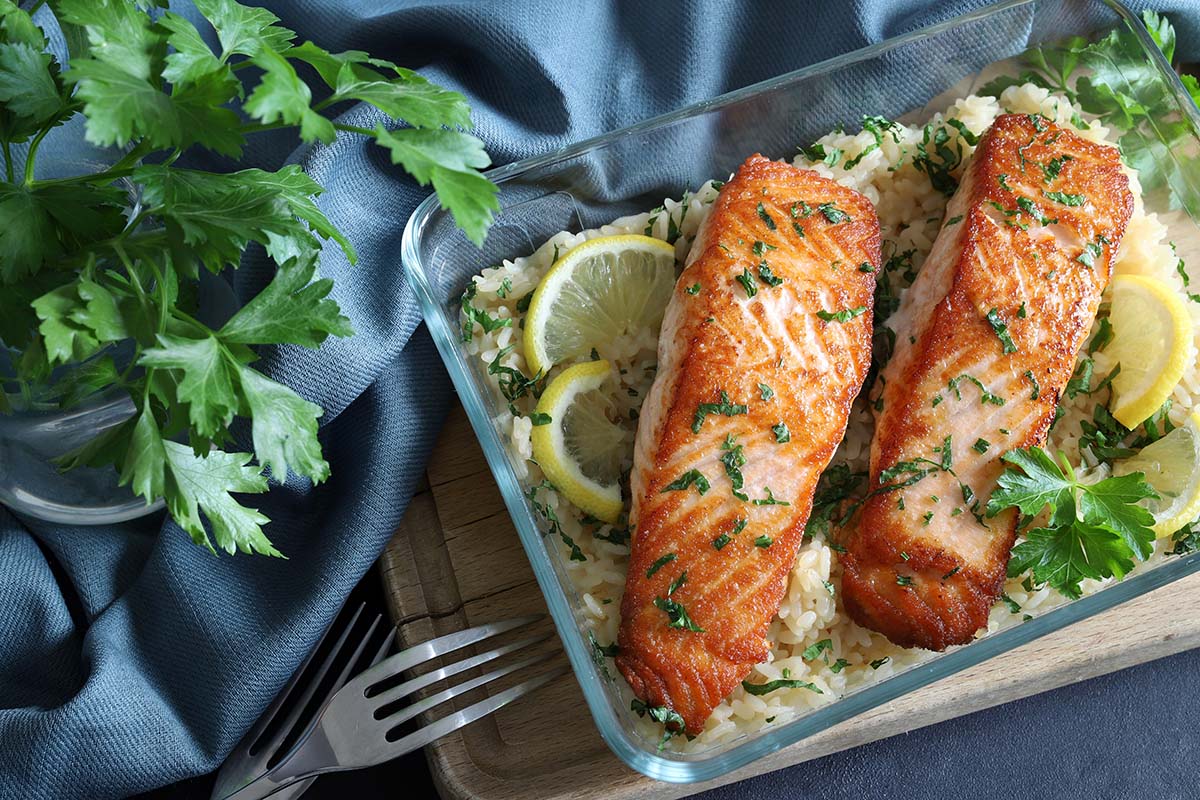 two baked fish fillets over rice. 