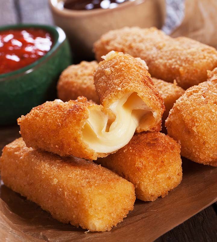 mozzarella sticks with marinara sauce on the side.